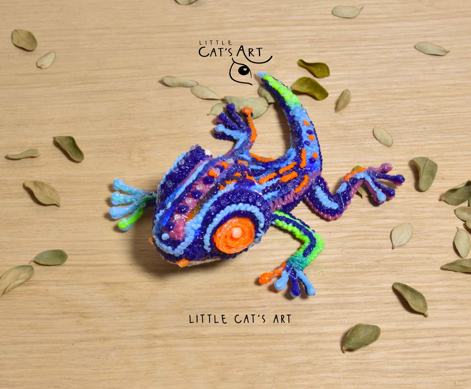 Multicoloured gecko figurine