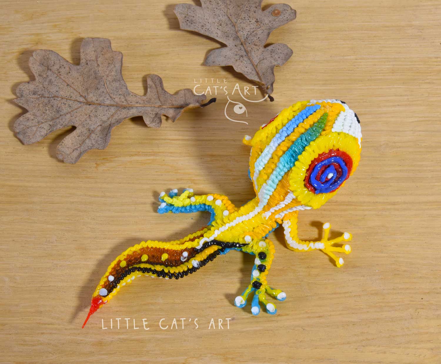 Yellow striped gecko figurine