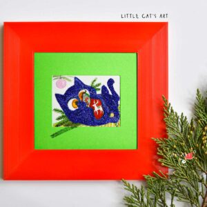 Glittery Blue kitty playing with Christmas Stocking under the Christmas tree
