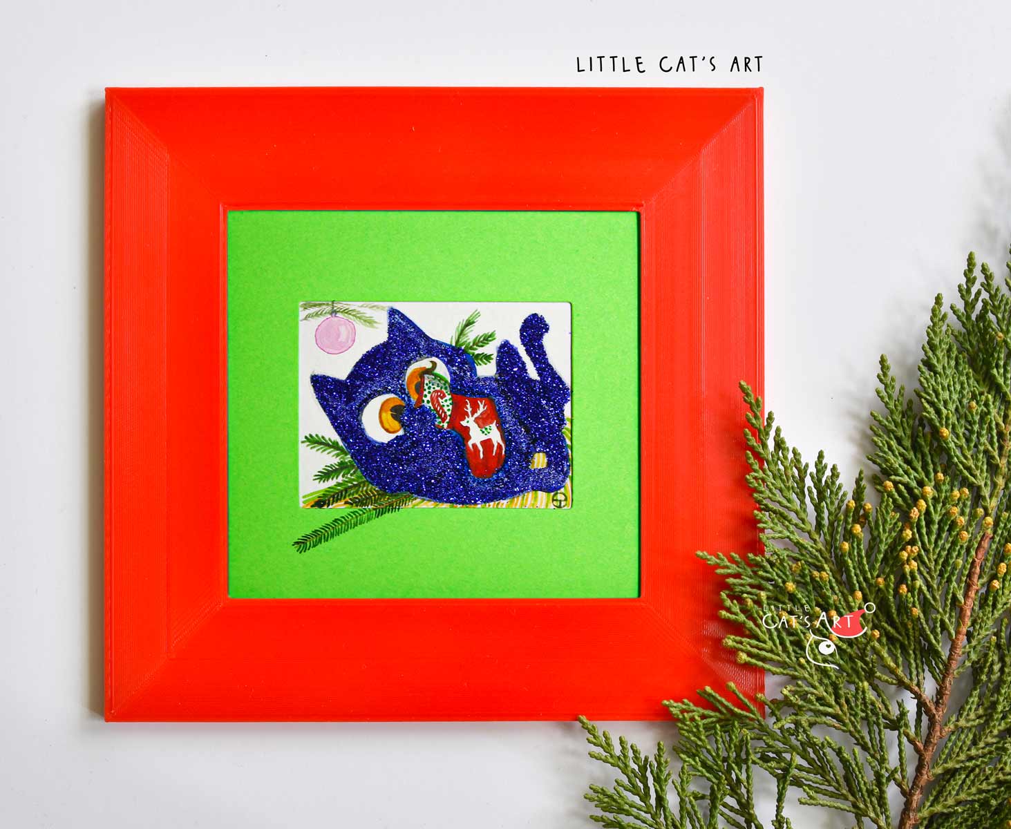 Glittery Blue kitty playing with Christmas Stocking under the Christmas tree